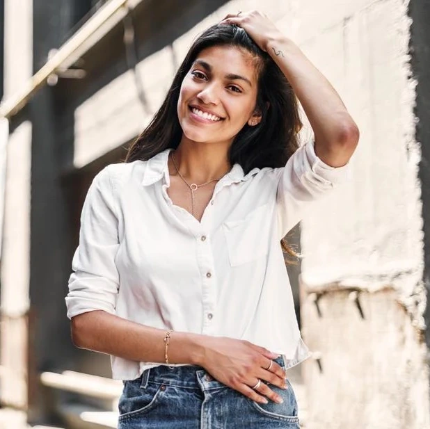 Model wearing a white button-up shirt